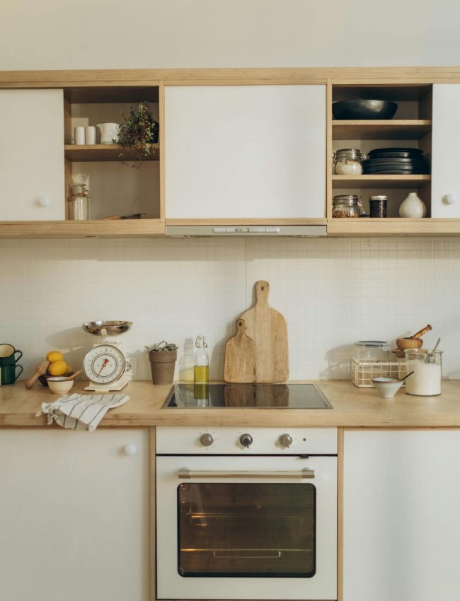 A well-organized modern kitchen featuring wooden cabinets and countertop, ideal for interior design inspiration.